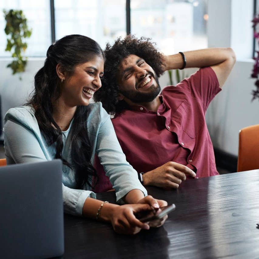 Cheerful young business colleagues in office