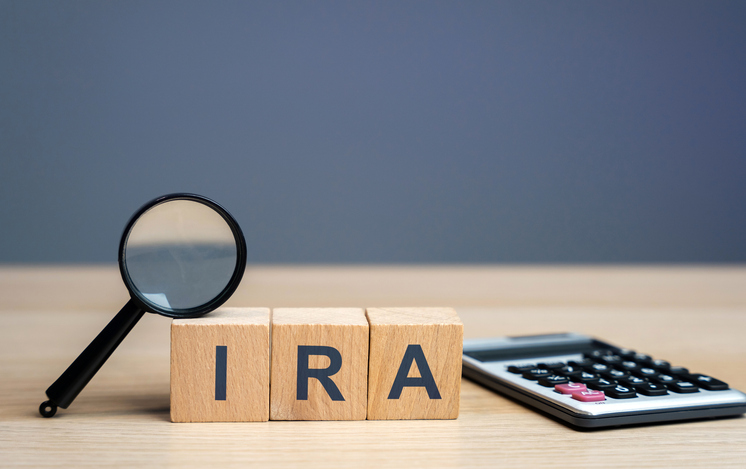 Three wood blocks spelling out the letters "IRA".